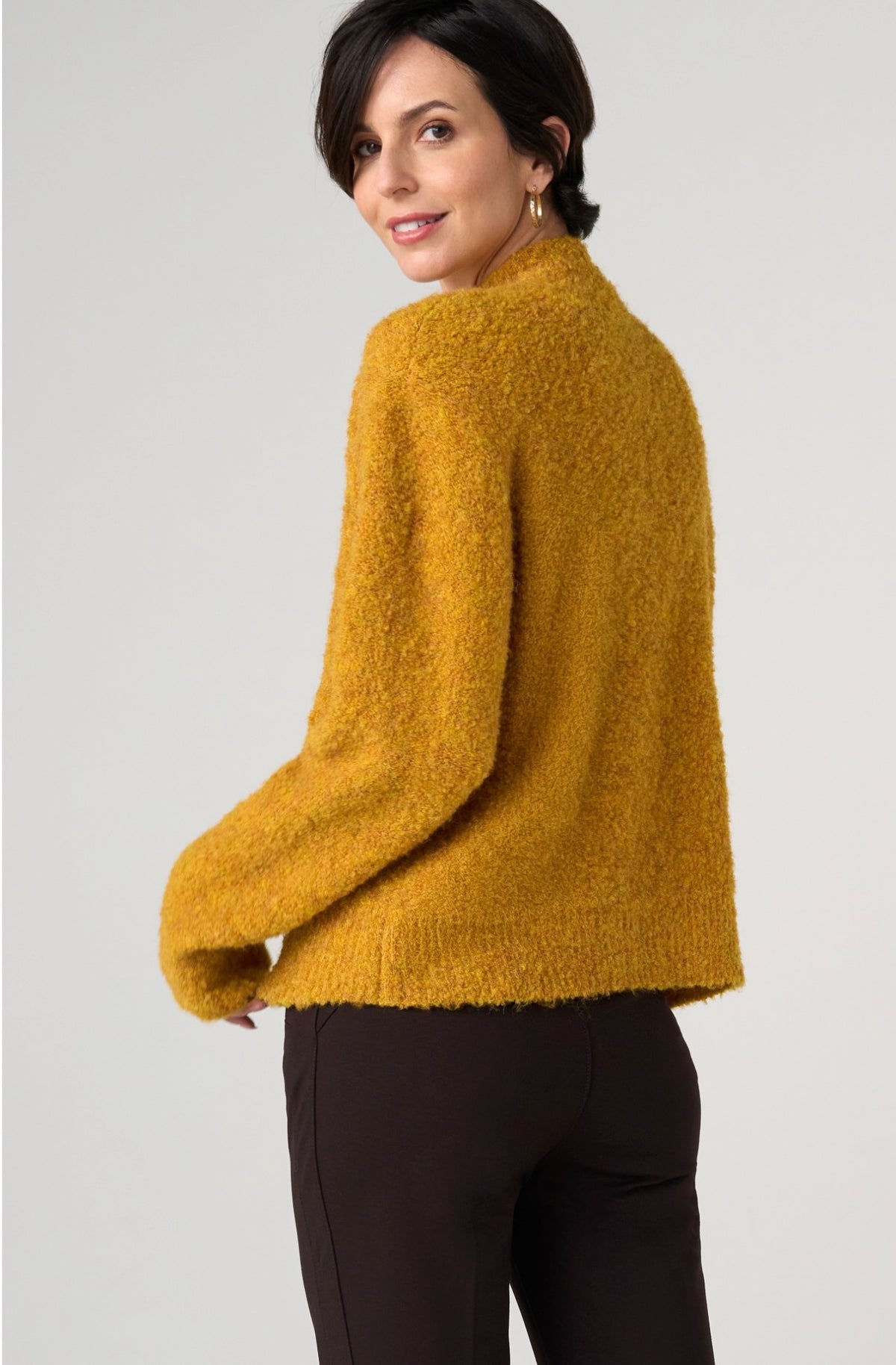 Long sleeve mock neck sweater with buttons on one side of shoulder