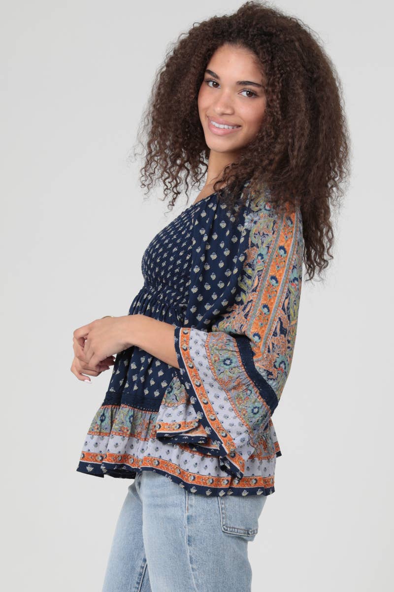 V NECK SMOCKED BUST WIDE BELL SLEEVE PRINTED TOP