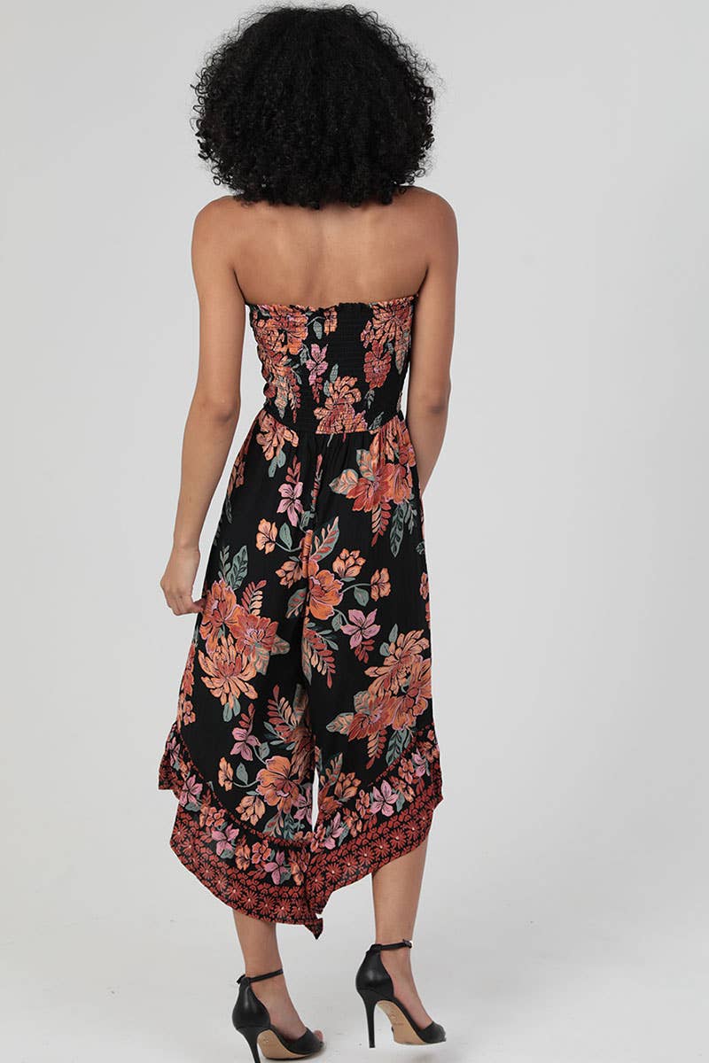SMOCKED BODICE STRAPLESS HANKY HEM JUMPSUIT
