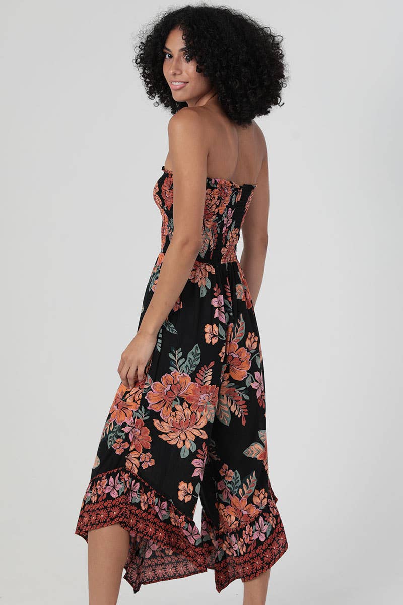 SMOCKED BODICE STRAPLESS HANKY HEM JUMPSUIT