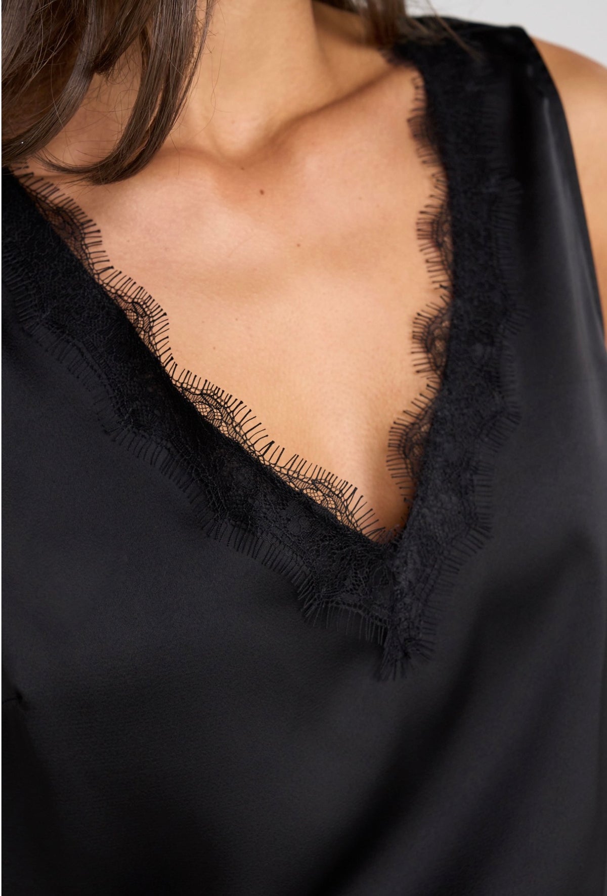 V-neck woven tank with lace trim in black